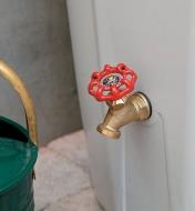Close-up of brass faucet on side of rain barrel