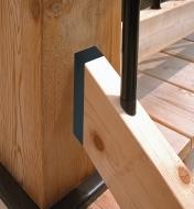 A deck stair railing connected to a post with a stair rail connector