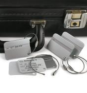 Security-Style Luggage Tag attached to a briefcase handle, with three more tags around it