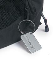 Security-Style Luggage Tag attached to a bag zipper