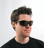 A man wearing Tinted Safety Glasses