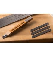 SharpDraw Pencil and three blades lying next to a ruler