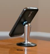 Phone attached to desktop pedestal, rotated to portrait orientation.