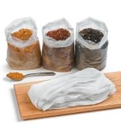 Three bags of shellac behind a wooden board with cheese cloth on top
