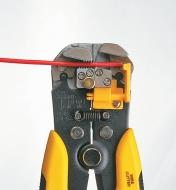 Close-up of wire stripper holding a wire