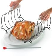 Sliding the two halves of the rack out from under the chicken on the platter