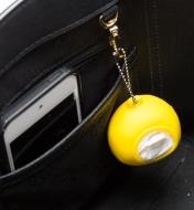 A Shopping Bag Pod attached to a hook inside a purse
