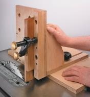 Veritas Surface Clamp holding a workpiece to a jig while cutting on a table saw