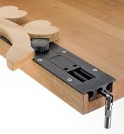 Holding an irregularly shaped workpiece with the inset vise and optional pivoting jaw installed in a workbench