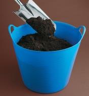 Filling a Tubtrug with soil using a spade