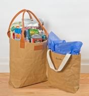 Two Tree Leather Tote Bags, one filled with groceries and the other used as a gift bag