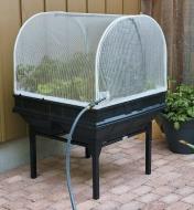 Vegepod Container Garden with a stand growing vegetables on a patio