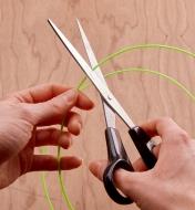 Cutting the FlexStraw with a pair of scissors