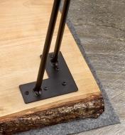 A 16-inch hairpin leg mounted on the corner of a live-edge coffee table