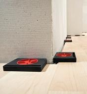 Bessey AV2 flooring spacers being used to offset flooring at a consistent distance from a wall