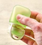 Holding a filled squeeze tube upside down