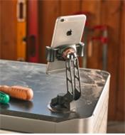 A phone mounted to a work surface using the Steelie FreeMount Kit
