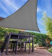 Underside view of a triangle shade sail providing shade on a patio