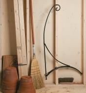 Shepherd's Hook Stand folded against a garage wall