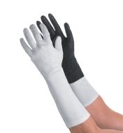 A pair of arms, one wearing a glove liner and the other wearing a glove liner under a glove