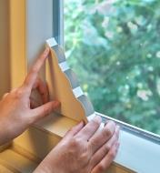Placing a Window Fly Trap in the bottom corner of a window
