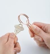 Threading a key onto a SqueezeRing Key Clip
