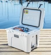 Yeti Tundra Hard-Sided 35 Cooler sitting on a dock with the lid open and food inside