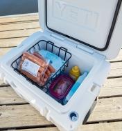 Yeti Tundra Hard-Sided 35 Cooler with lid open, showing food and ice packs inside