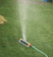 Hozelock Multi-Adjust Sprinkler/Mister watering a lawn with mist spray setting