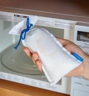Placing a Dehumidifier Bag in a microwave to recharge it