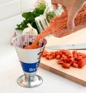 Pouring lentils into the Dry-Weight Measuring Cup, English