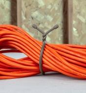 18” taupe gear tie used to bundle a long extension cord