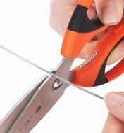 Cutting wire with the built-in wire cutter on the back of the scissors blade