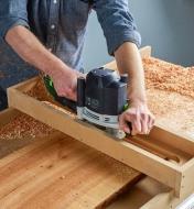 Used with a router sled, a router with a flattening bit is passed across a wood slab to flatten it