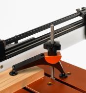 Pivot clamp being used to hold a piece of wood flat to the top of the Jointmaker Pro