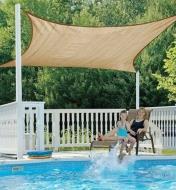 Square Shade Sail installed over a swimming pool
