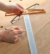 Using the adjustable square to mark a miter across a board