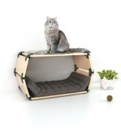 A cat sits on a cat bed constructed with 150° Black Playwood Connectors