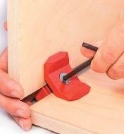 Tightening a 90° Red Playwood Connector with a hex key