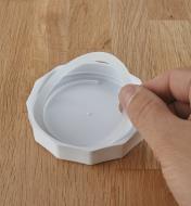 Removing the gasket from a canning jar lid