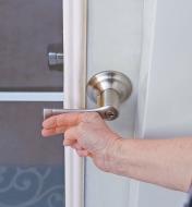 Pushing on the Harper door handle to open the door