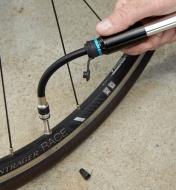 Pumping a bicycle tire with the mini bike bump