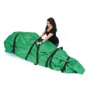 A woman cinches the straps on a Christmas tree transfer bag wrapped around a tree that is lying down