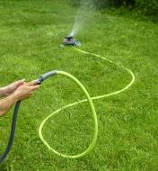 15' Flexzilla Hose connected between a sprinkler and an in-line valve and garden hose