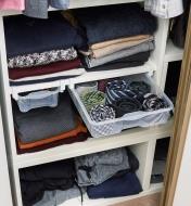 Hanging drawers installed in a closet, holding neckties