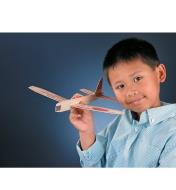 A boy plays with an assembled Balsa Glider