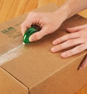 Opening a cardboard box with a Mini Utility Knife