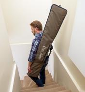 Carrying the small guide rail bag down stairs with the shoulder strap
