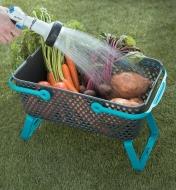 Rinsing garden vegetables in the Medium Stacking Basket