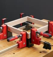 Bessey KP blocks used to hold clamps criss-crossed for holding a framing project